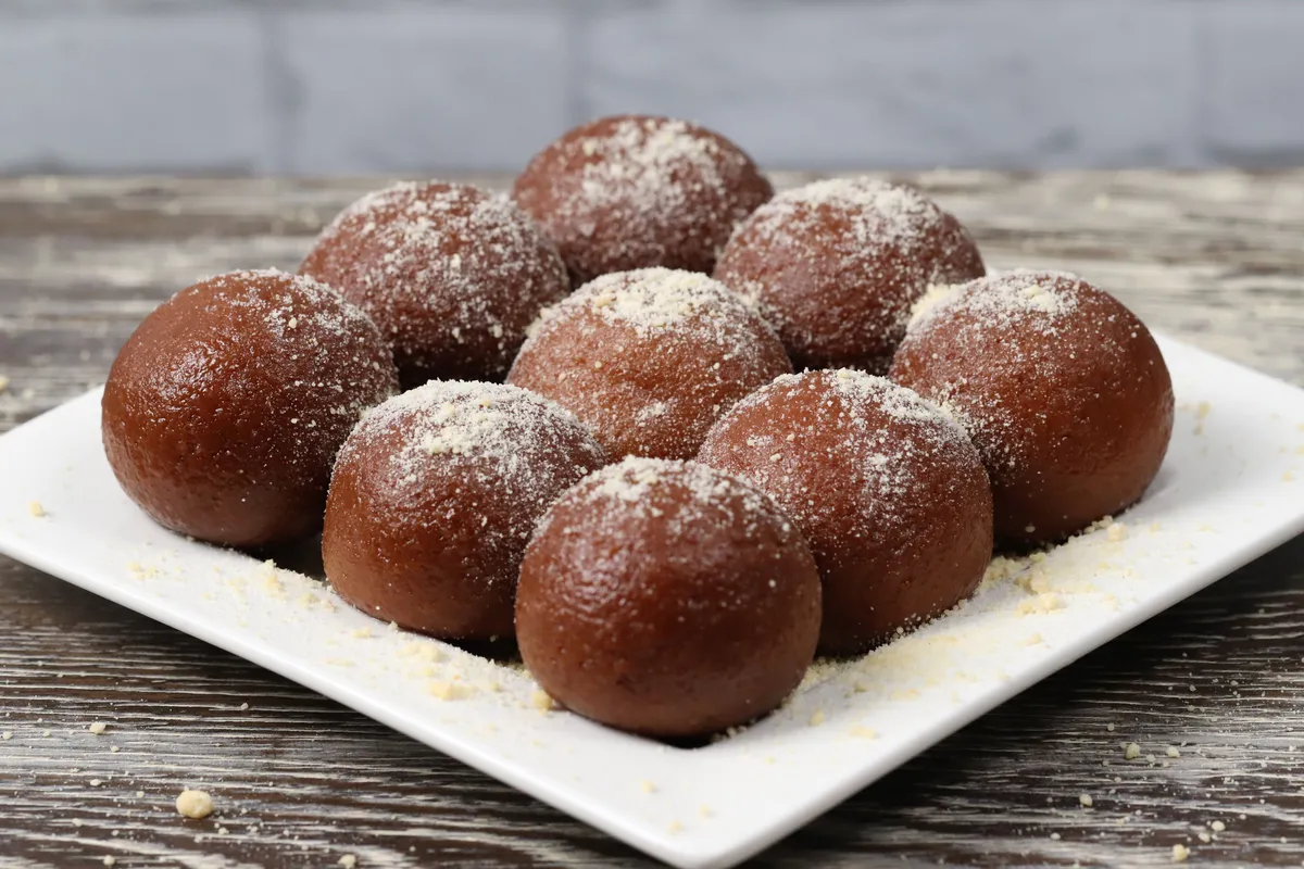 Gulab Jamun - Classic Indian sweet dumplings in rose-flavored syrup